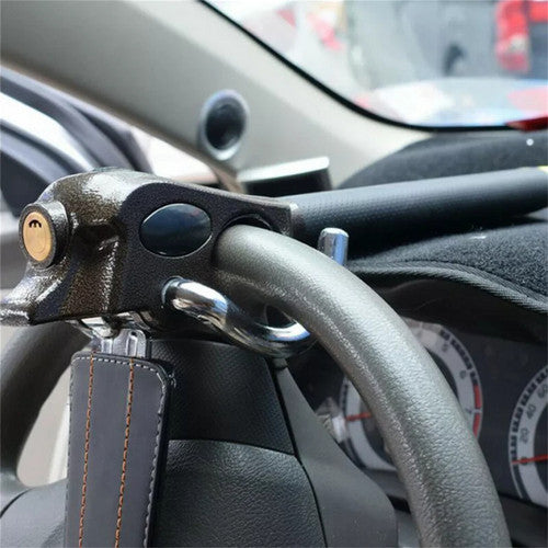 Close-up of a car's steering wheel lock and dashboard interior