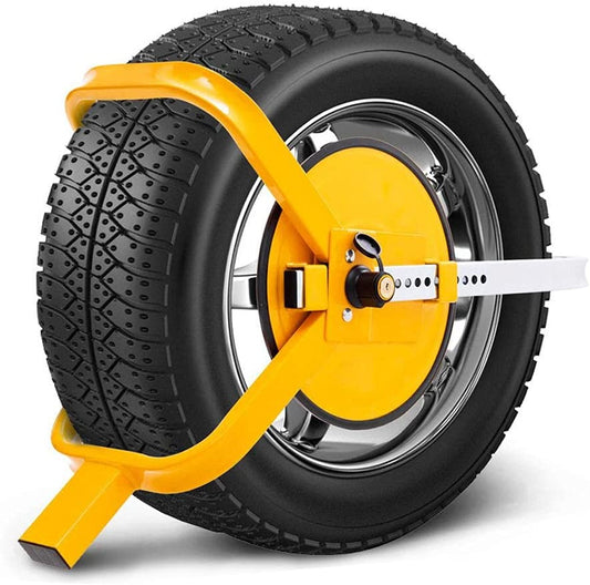 Yellow wheel clamp lock around a black tyre on a white background