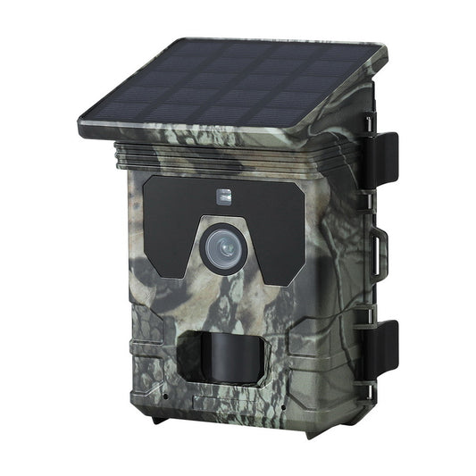 Camouflage-patterned wildlife camera with solar panel on a white background