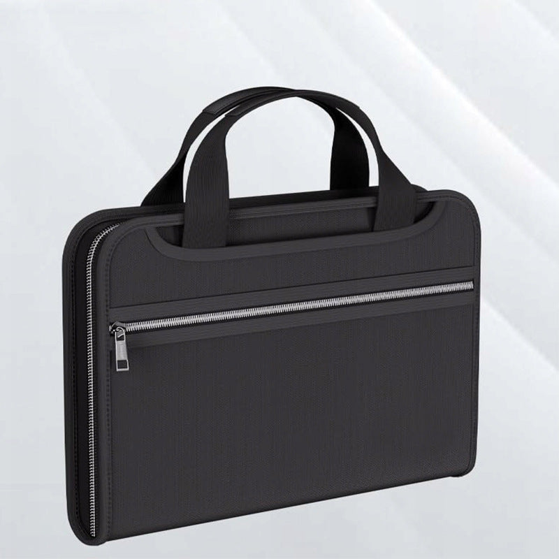 Fireproof and waterproof expanding document organiser with zip closure and carry handles in black.