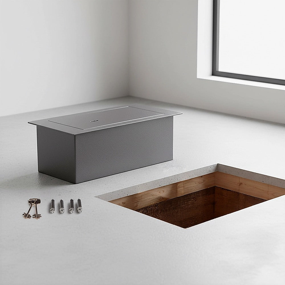 Heavy-duty hidden floor safe with key lock beside an underfloor installation opening for concealed home security.