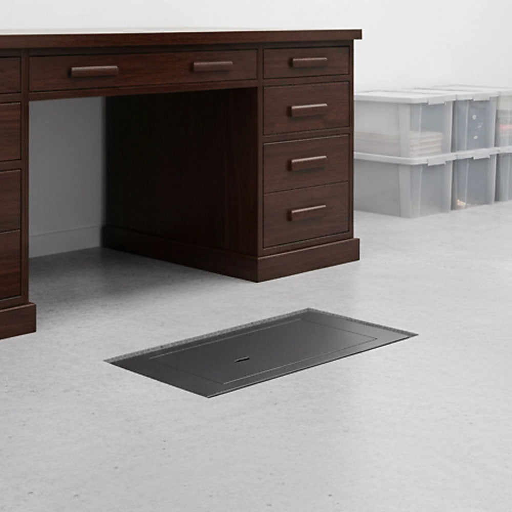 Concealed underfloor safe installed flush with the floor in a home.