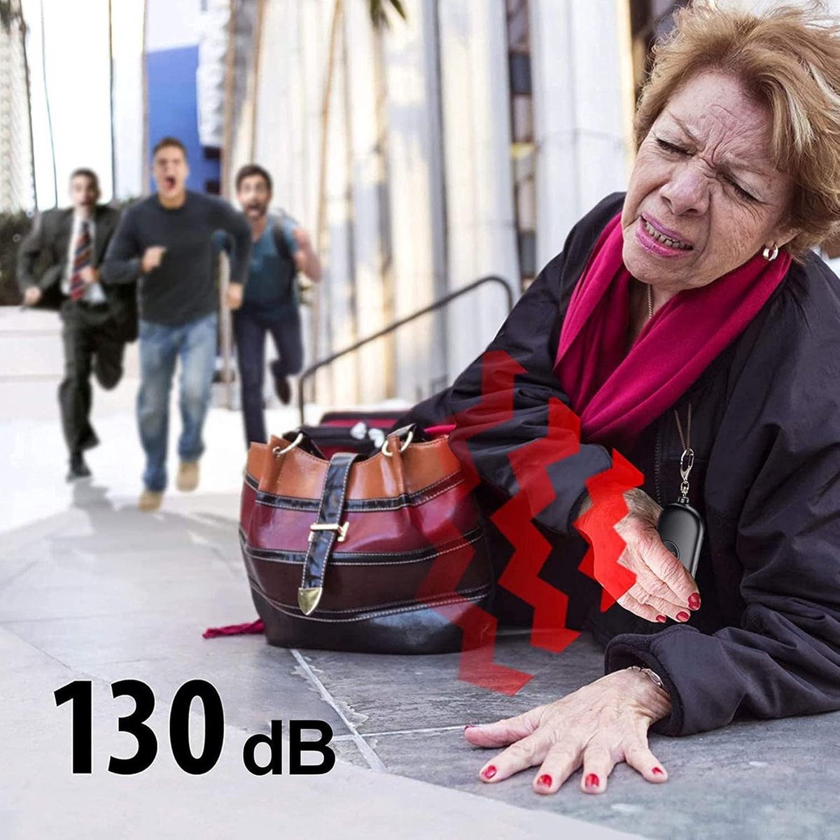 Woman using a 130dB rechargeable personal safety alarm to attract attention during an emergency