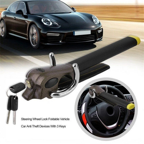 Steering wheel lock with keys and car in the background